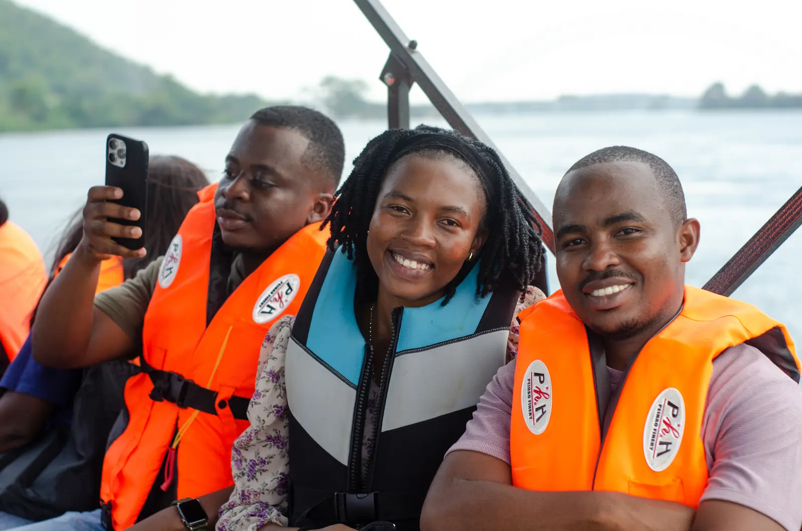 Youth participants in life jackets during a field visit