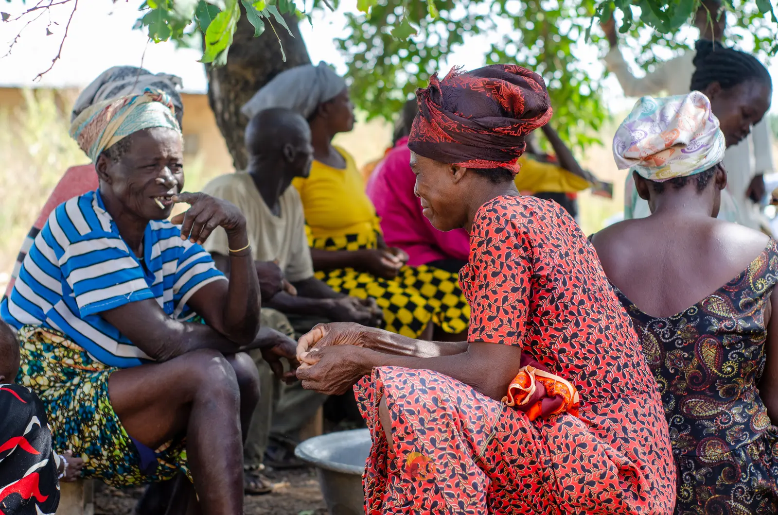 Community members exchanging local climate knowledge outdoors